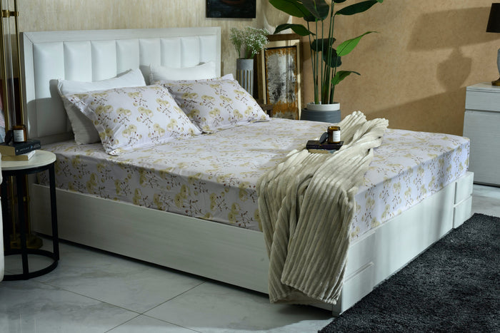 Floral micro fiber bed sheet set with pillowcases, fitted on a bed
