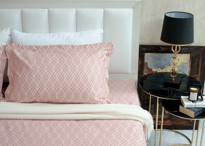 Pink diamond-pattern bed sheet and pillowcase with folded white border