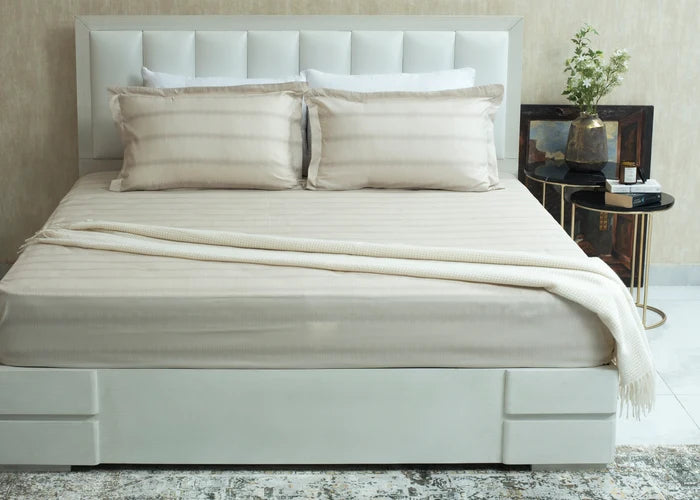 Single beige cotton bed sheet set with shams and draped sheet with fringe trim
