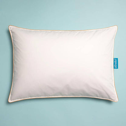 White down-filled pillow with orange-trimmed border and neatly stitched edges.