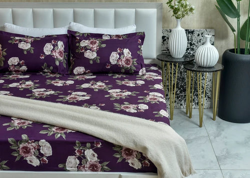 Purple floral pillow cover with white and pink rose print, decorative trim