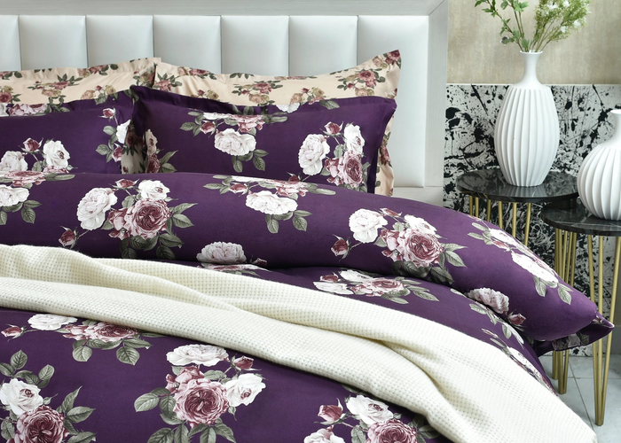 Purple rose-print pillow cover with floral backing and light hem detail