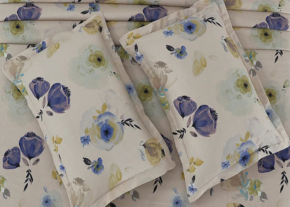 Set of cream cotton pillow covers with blue and yellow-green flower design