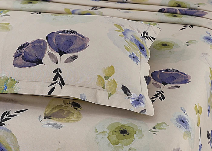 Cream cotton pillow cover with close-up blue floral and green leaf pattern