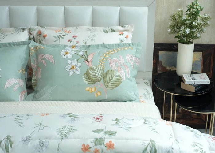 Sea grass cotton pillow cover set on bed with floral and leaf pattern