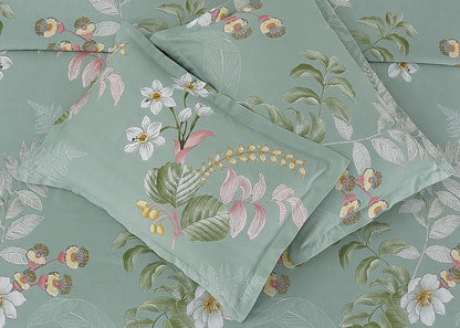 Sea grass cotton pillow cover with assorted botanical prints in teal, green, and coral