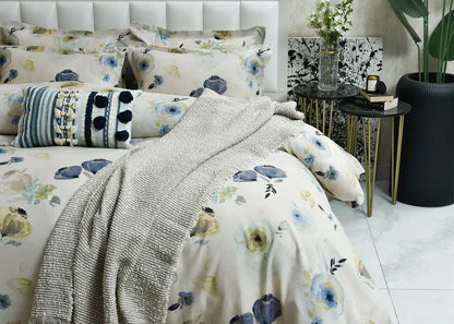Cotton pale quilt cover with blue and yellow floral print, shown with light textured fabric