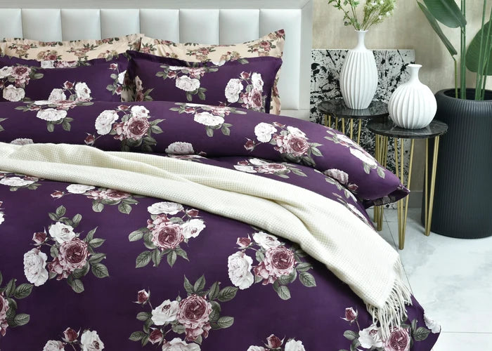 Purple floral quilt cover, folded with matching pillow sham