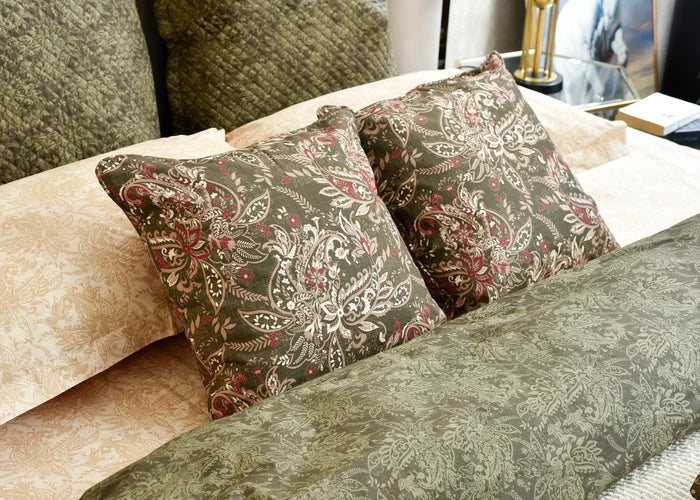 Square cushion cover with ornate paisley floral pattern in olive and dark brown