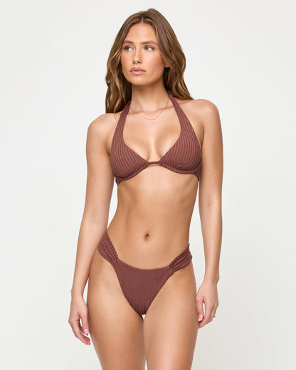 Front view of a model wearing the LSPACE cafe Isa Bikini Top with a matching ribbed bikini bottom.