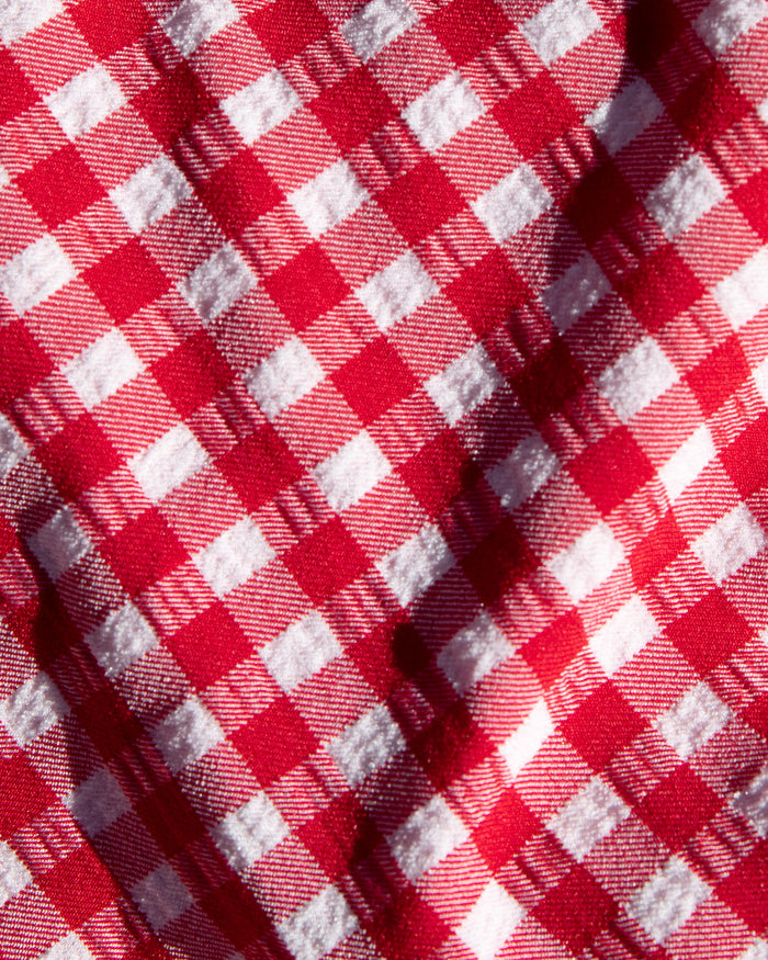 Close-up of red and white gingham check fabric used in the LSPACE lipstick red.