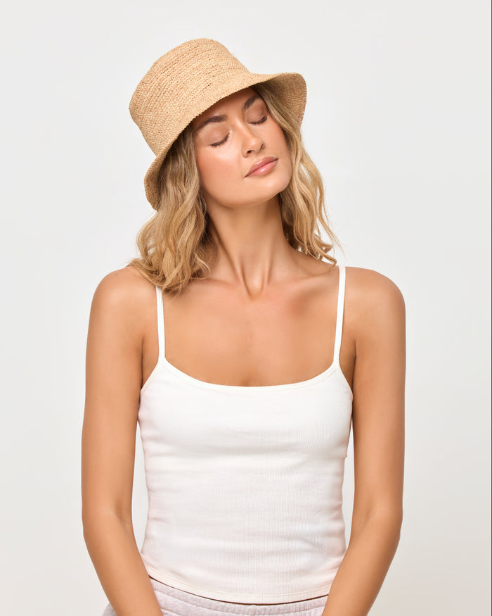 LSPACE Isadora bucket hat in natural, close-up detail view on model.