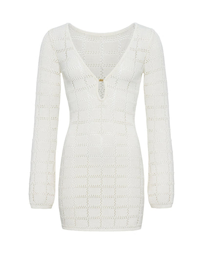 Off-model view of the LSPACE Jessa Mini in cream, a cream open-knit crochet mini dress with a geometric diamond pattern, V-neckline, and gold keyhole hardware.