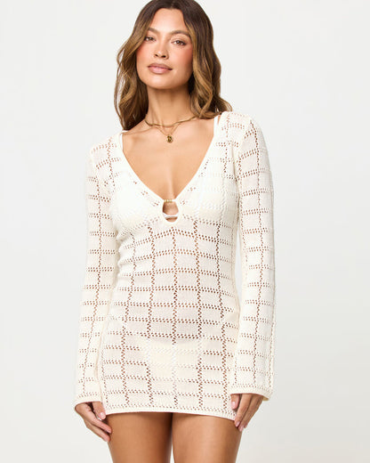 Close-up of a model wearing the LSPACE Jessa Mini in cream, highlighting the V-neckline with gold keyhole hardware detail.