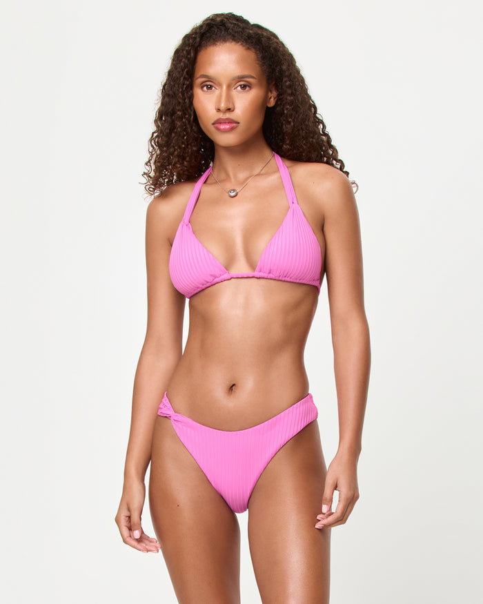 Front view of a model wearing the LSPACE Sweetheart Kami Bikini Top with ribbed triangle silhouette and halter strap, paired with the Chrissy Bikini Bottom.