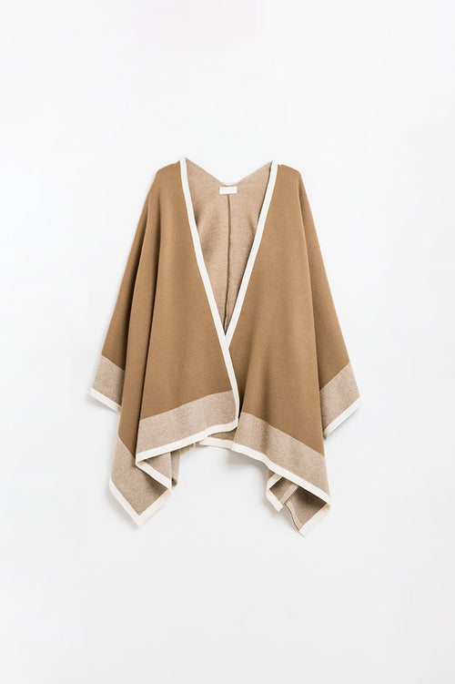 Knitted poncho in camel with ecru trim