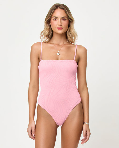 Pink Sugar | Badge:New Arrival_#B2AC88_#ffffff'
LSPACE La Femme one piece swimsuit in Pink Sugar, front view on model with straps.