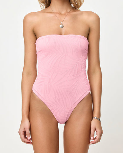 LSPACE La Femme one piece swimsuit in Pink Sugar, close-up detail view on model styled strapless.