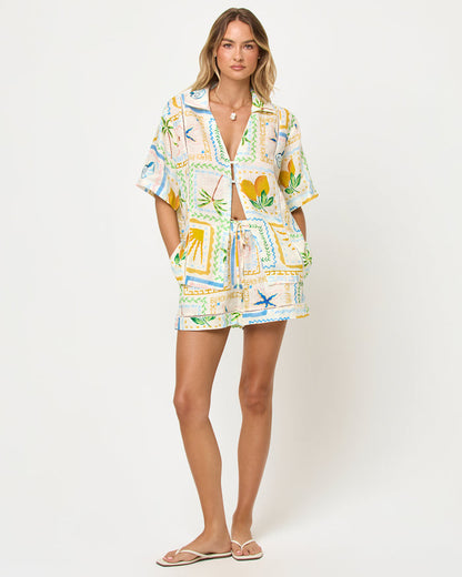 LSPACE La Mer Short in Wish You Were Here print, front view on model with matching top.