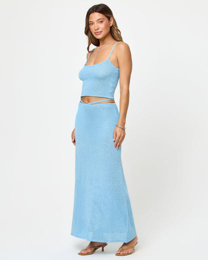 LSPACE Last Light Top and Skirt in Sky Blue, three-quarter view on model.
