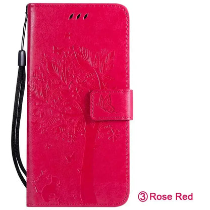 the back of a red leather wallet case with a flower design