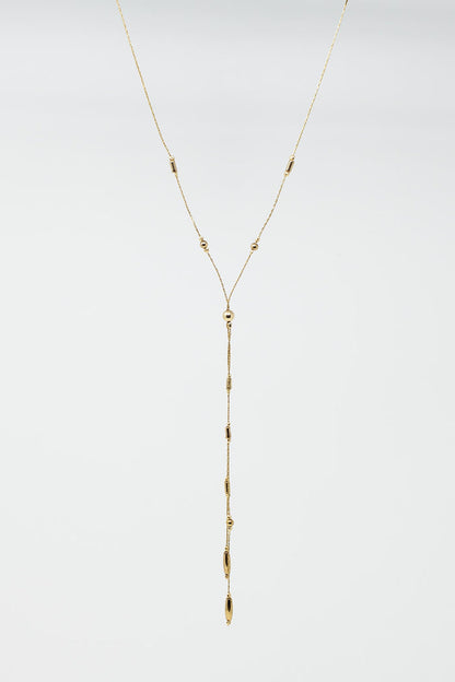 Long Gold Necklance with golden beads throughout and Long golden Tassle