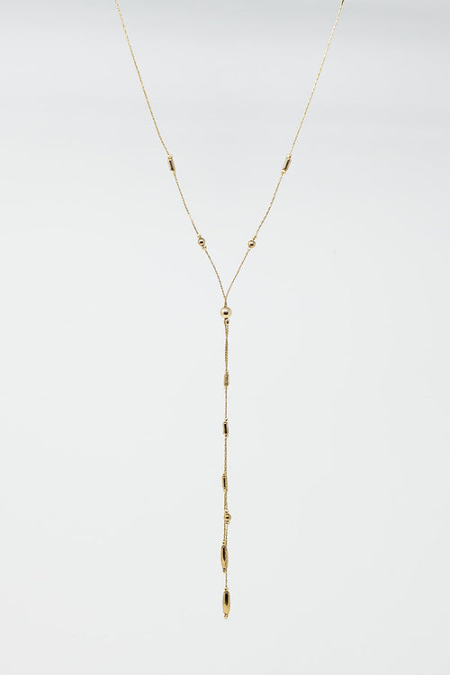 Long Gold Necklance with golden beads throughout and Long golden Tassle