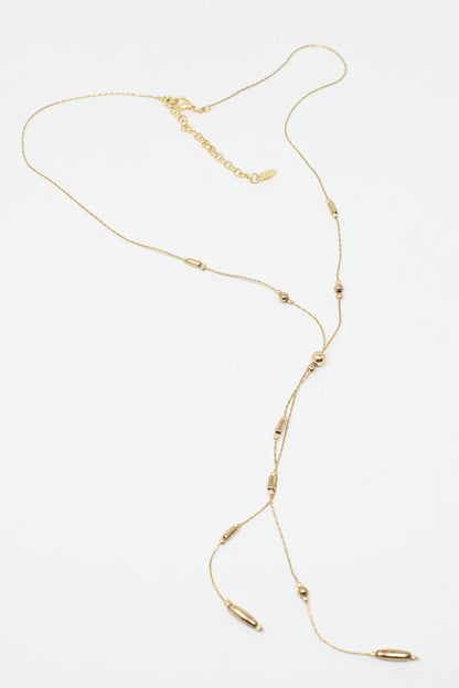 Long Gold Necklance with golden beads throughout and Long golden Tassle
