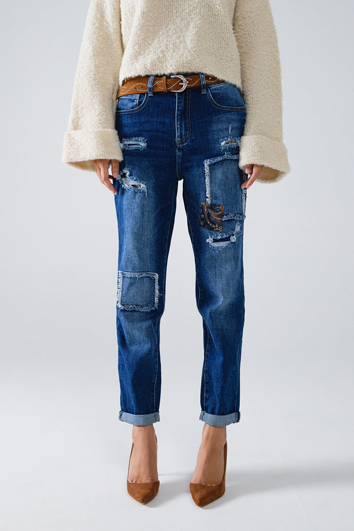 Loose blue jeans with subtle ripped design and patches - Denim