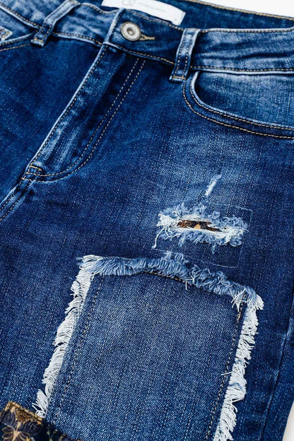Loose blue jeans with subtle ripped design and patches - Denim
