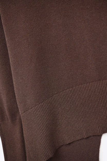 Loose brown sweater with open back detail