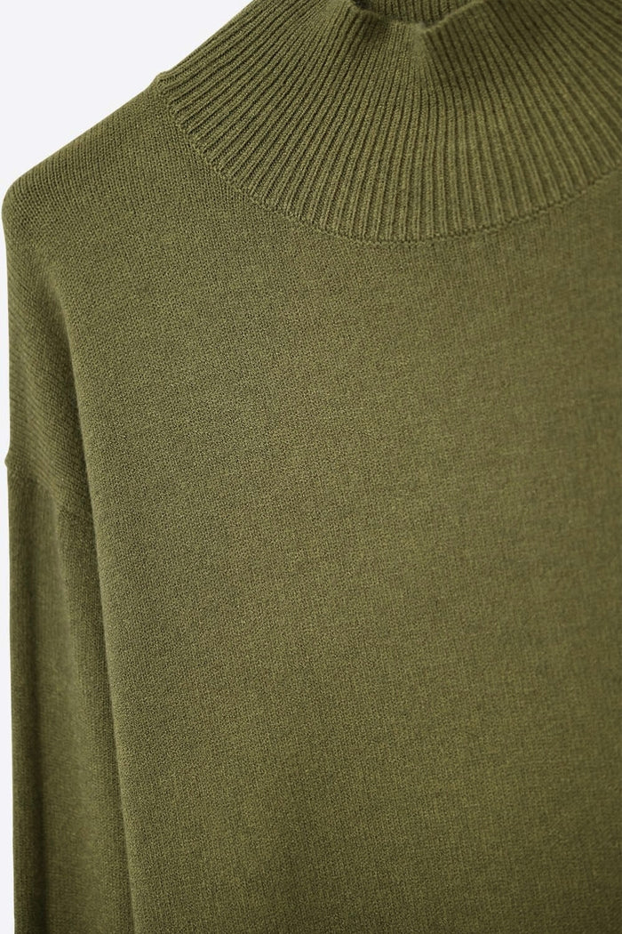 Loose military green sweater with open back detail
