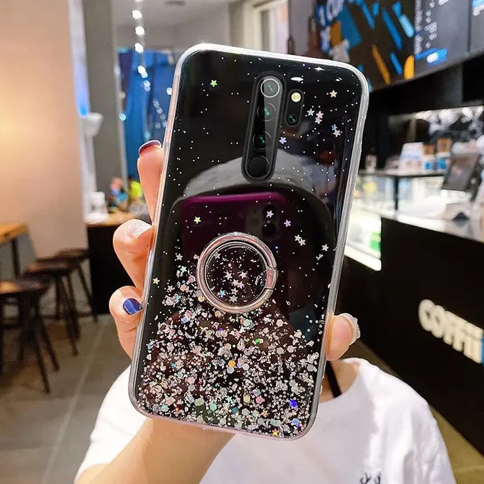 a woman holding up a phone case with a phone holder