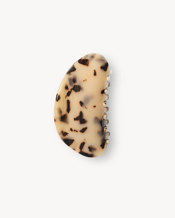 View from above of the Machete Crescent Claw Clip in blonde tortoise