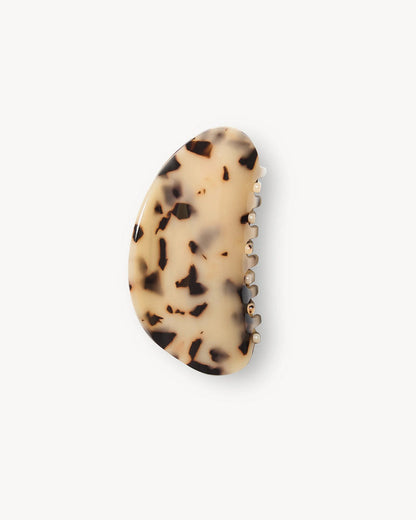 View from above of the Machete Crescent Claw Clip in blonde tortoise