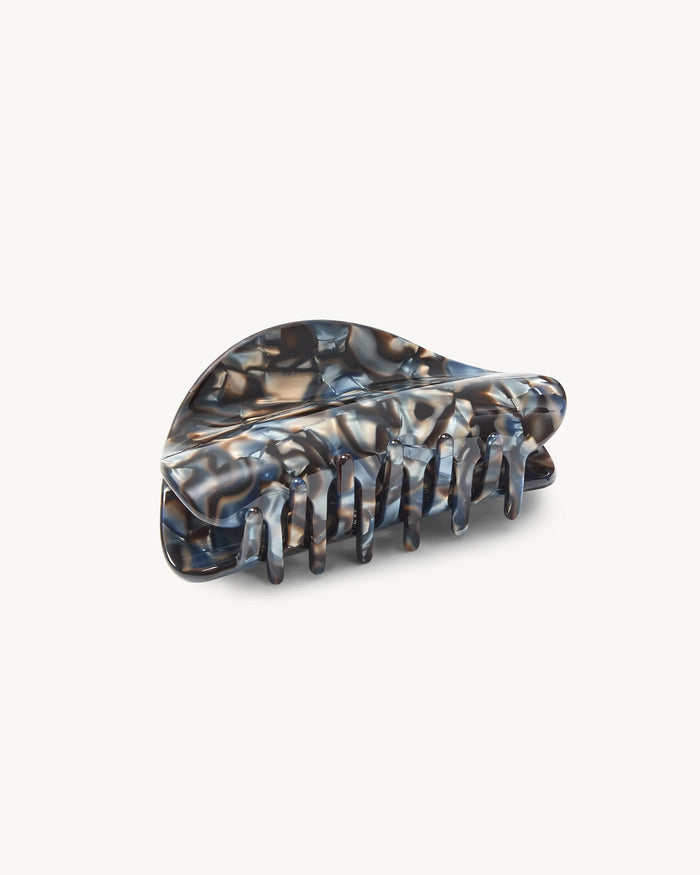 Bottom view of the Machete Crescent Claw Clip in blue horn showing the claw prongs