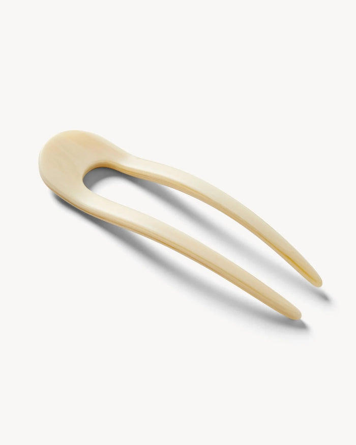 Angled view of the white Machete French Hair Pin showing the resin finish.