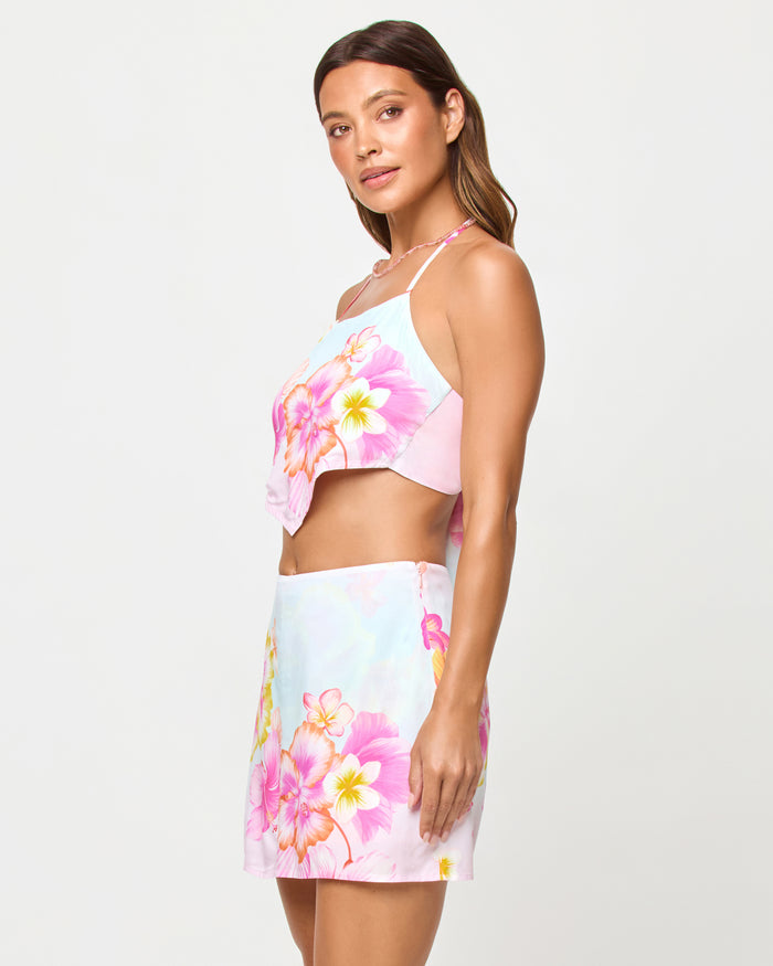 LSPACE Maia top in Hibiscus And Plumeria Oh My print, three-quarter view on model.