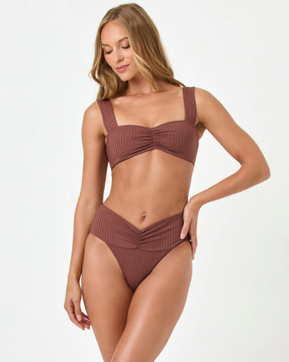 Front view of a model wearing the LSPACE cafe Marlee Bikini Top with matching cafe Bardot Bikini Bottom.