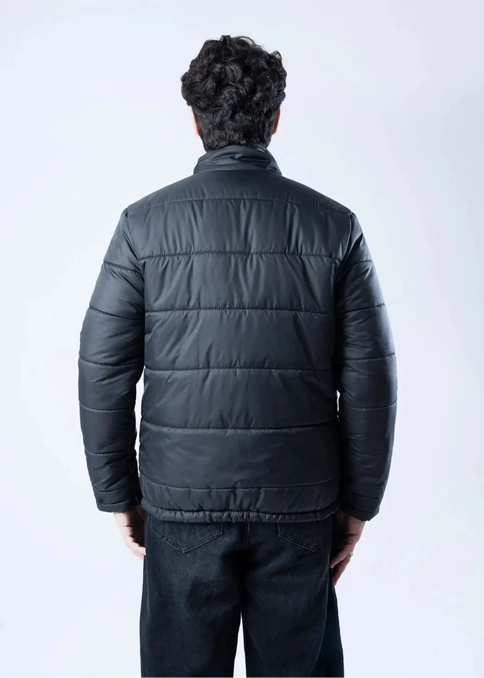 Men's black quilted bubble jacket, back view with horizontal baffle quilting
