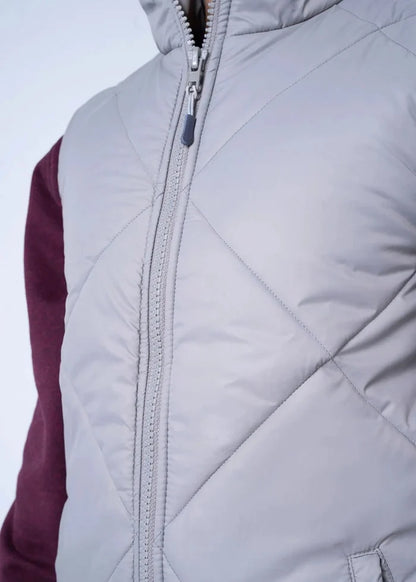 Grey quilted puffer vest-jacket close-up of full-length front zipper