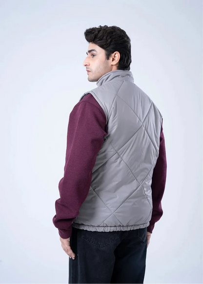 Grey quilted puffer vest-jacket with stand collar and diamond quilting (side view)