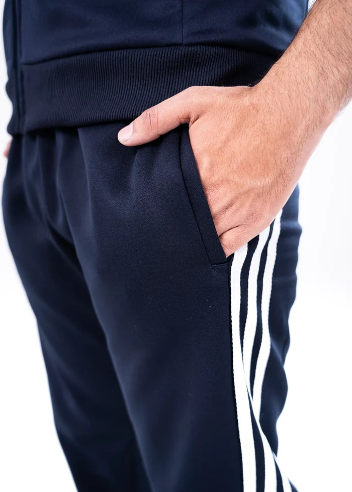 Navy jogger pants with white side stripes and front pocket detail