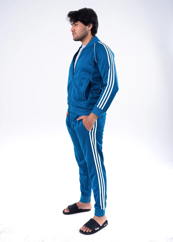 Men's blue tracksuit set, side view: zip-up hooded jacket and jogger pants with white stripes