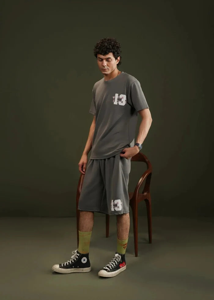 Men's charcoal grey knitted casual shorts, knee-length with front graphic detail