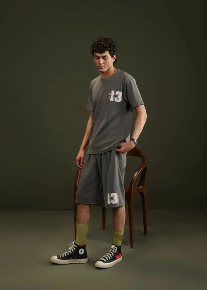 Men's charcoal grey knitted casual shorts, knee-length with front graphic detail