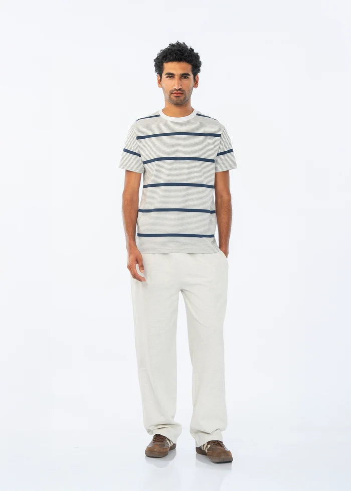 Men's summer night suit: blue-striped crew T-shirt and light straight-leg pants.
