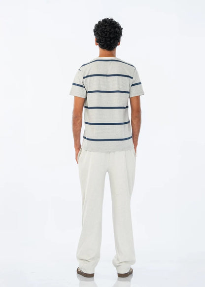 Men's summer night suit, back view: blue striped crew T-shirt with light pants.