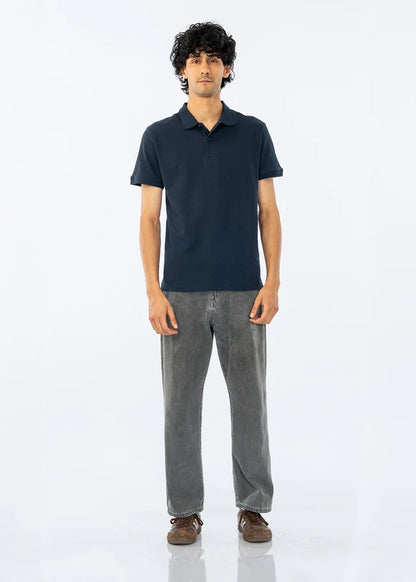 Men's dark polo shirt with short sleeves and button placket, solid knit fabric