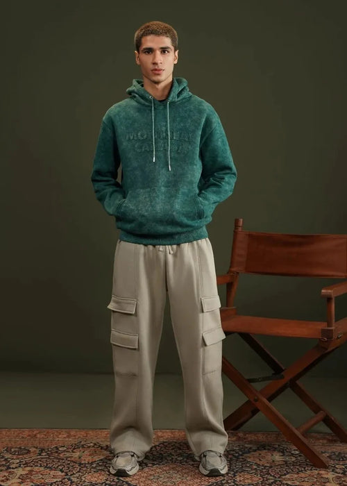 Teal terry pullover hoodie with hood drawstrings and front kangaroo pocket